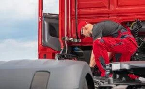 Professional Truck Mechanic Performing Semi Truck Repair